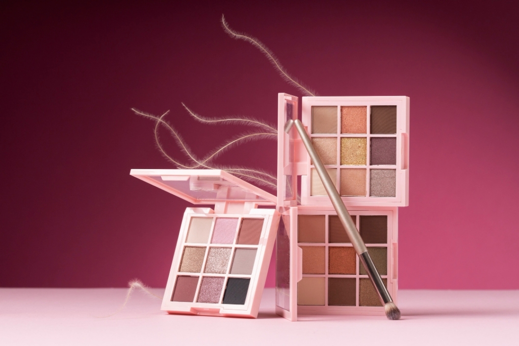 View of eyeshadow palette with brush applicator